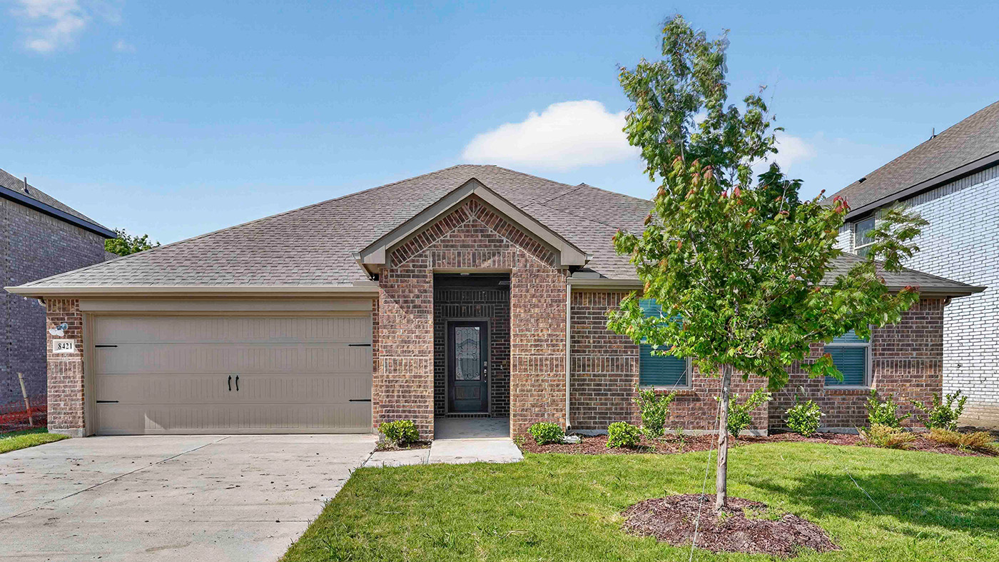 exterior of one story home with brick