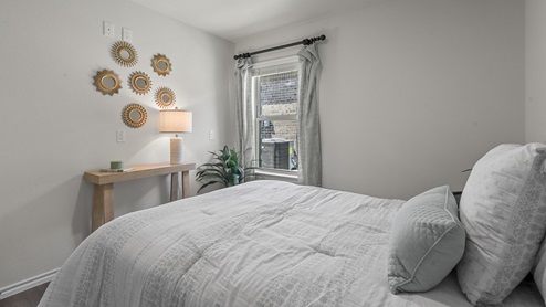 1304 Quest Bridge Road secondary bedroom with queen sized bed and carpet