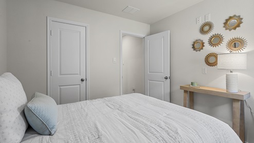 1304 Quest Bridge Road secondary bedroom with queen bed and carpet