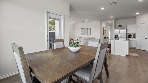 1304 Quest Bridge Road dining area with view of open concept first floor with hardwood floors
