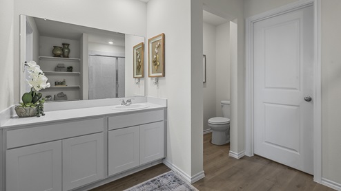 1304 Quest Bridge Road primary bathroom with hardwood floors