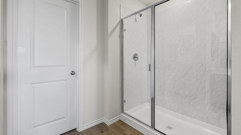 1304 Quest Bridge Road primary bathroom with hardwood floors