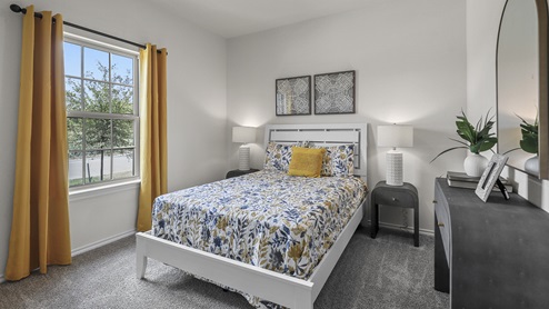 1308 Quest Bridge Road secondary bedroom with carpet and natural lighting
