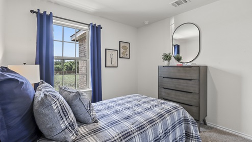 1308 Quest Bridge Road secondary bedroom with natural lighting and carpet
