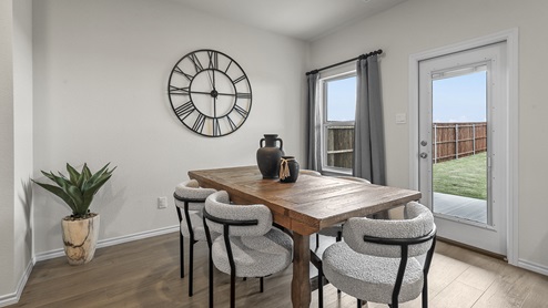 1308 Quest Bridge Road dining area with natural lighting and hardwood floors