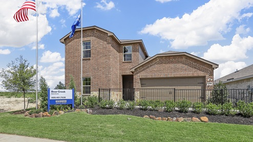 1308 Quest Bridge Road two story model home with beautiful red brick