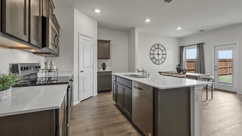 1308 Quest Bridge Road kitchen area with view of dining area with hardwood floors