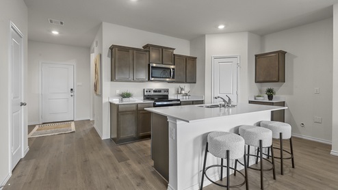 1308 Quest Bridge Road kitchen area with hardwood floors and view of interior entry