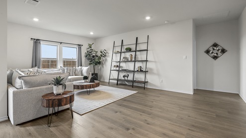 1308 Quest Bridge Road open concept living area with hardwood floors and natural lighting