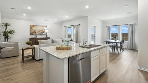 kitchen with white cabinetry, large island and stainless steel appliances