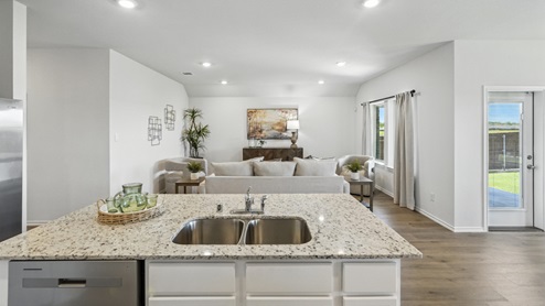 kitchen with white cabinetry, large island and stainless steel appliances
