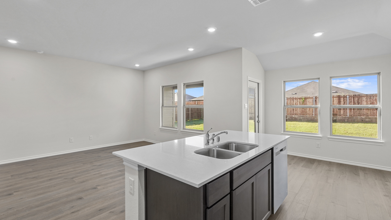 kitchen island overlooking living room and breakfast nook