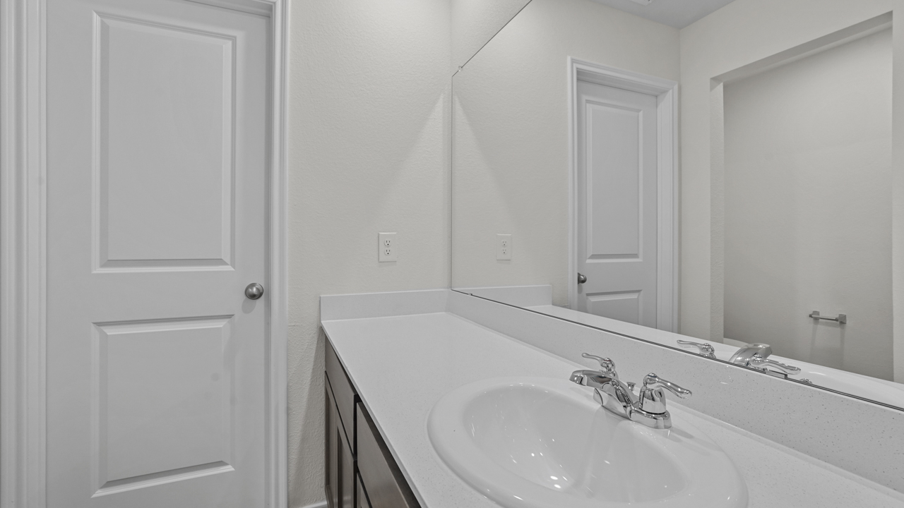 primary bathroom with elongated vanity and sink