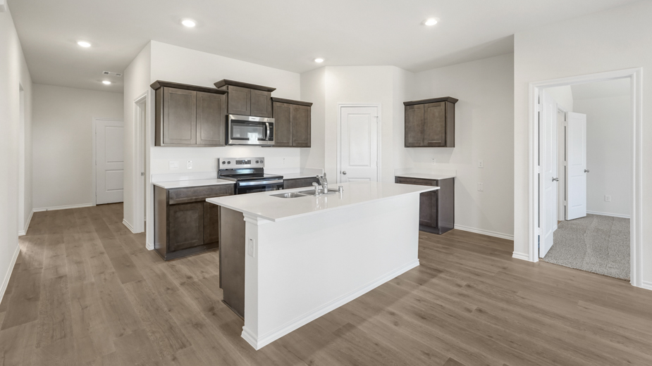 kitchen with large island and brown cabinets