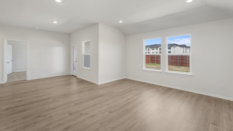living area with double windows overlooking breakfast nook