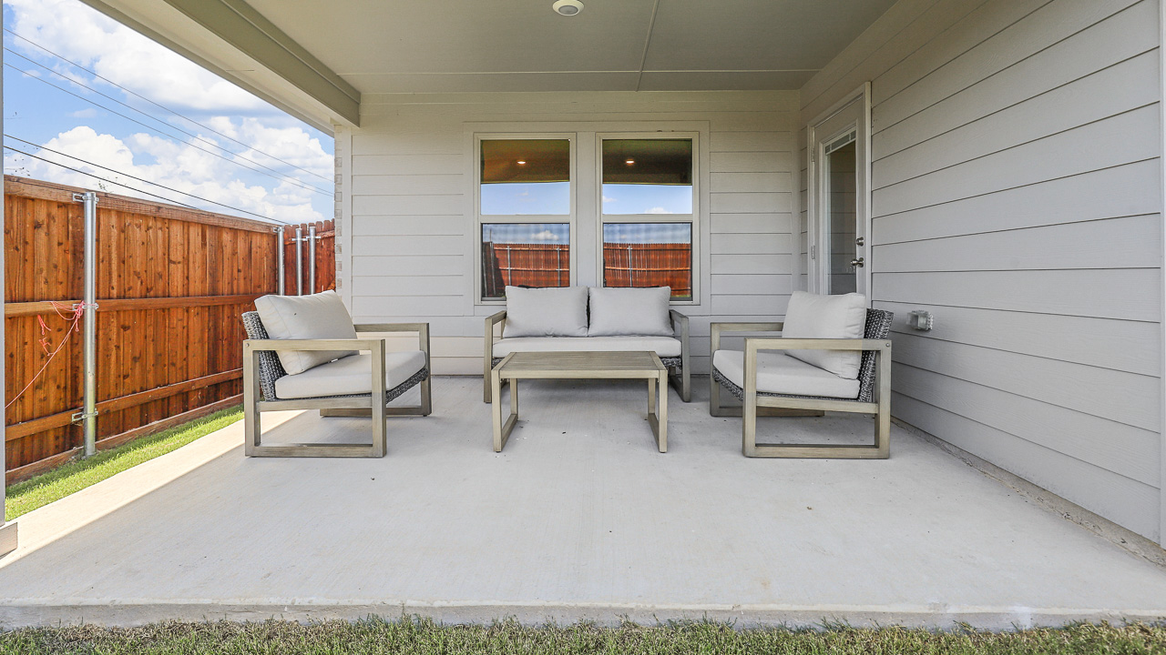 large covered patio with furniture