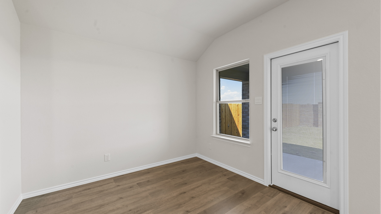 breakfast nook with back door and window