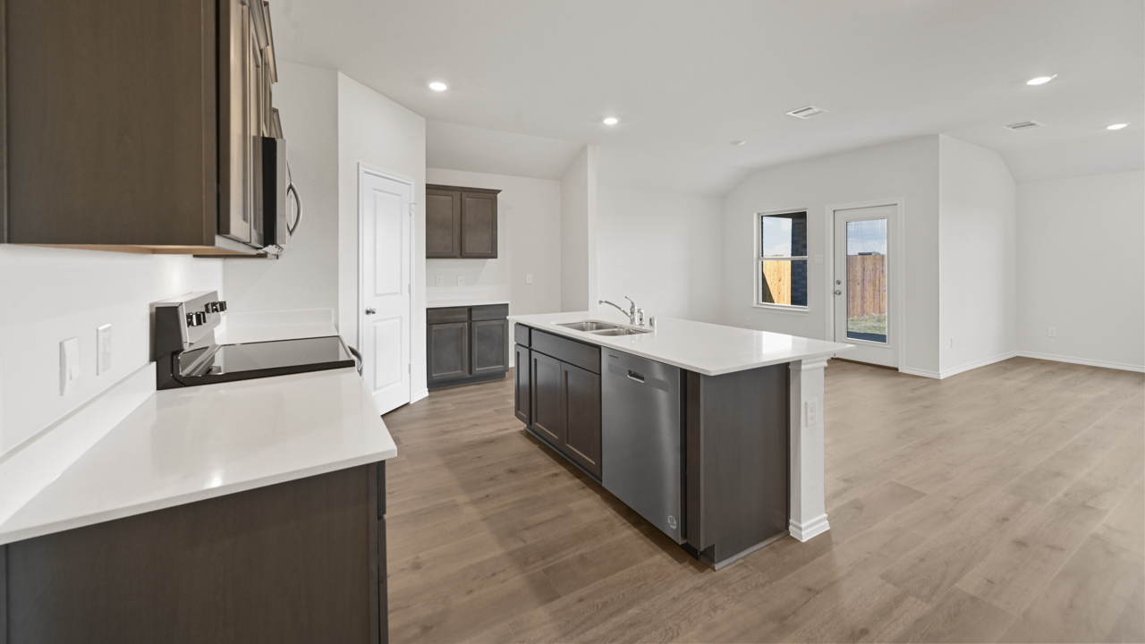 kitchen with island with brown cabinets
