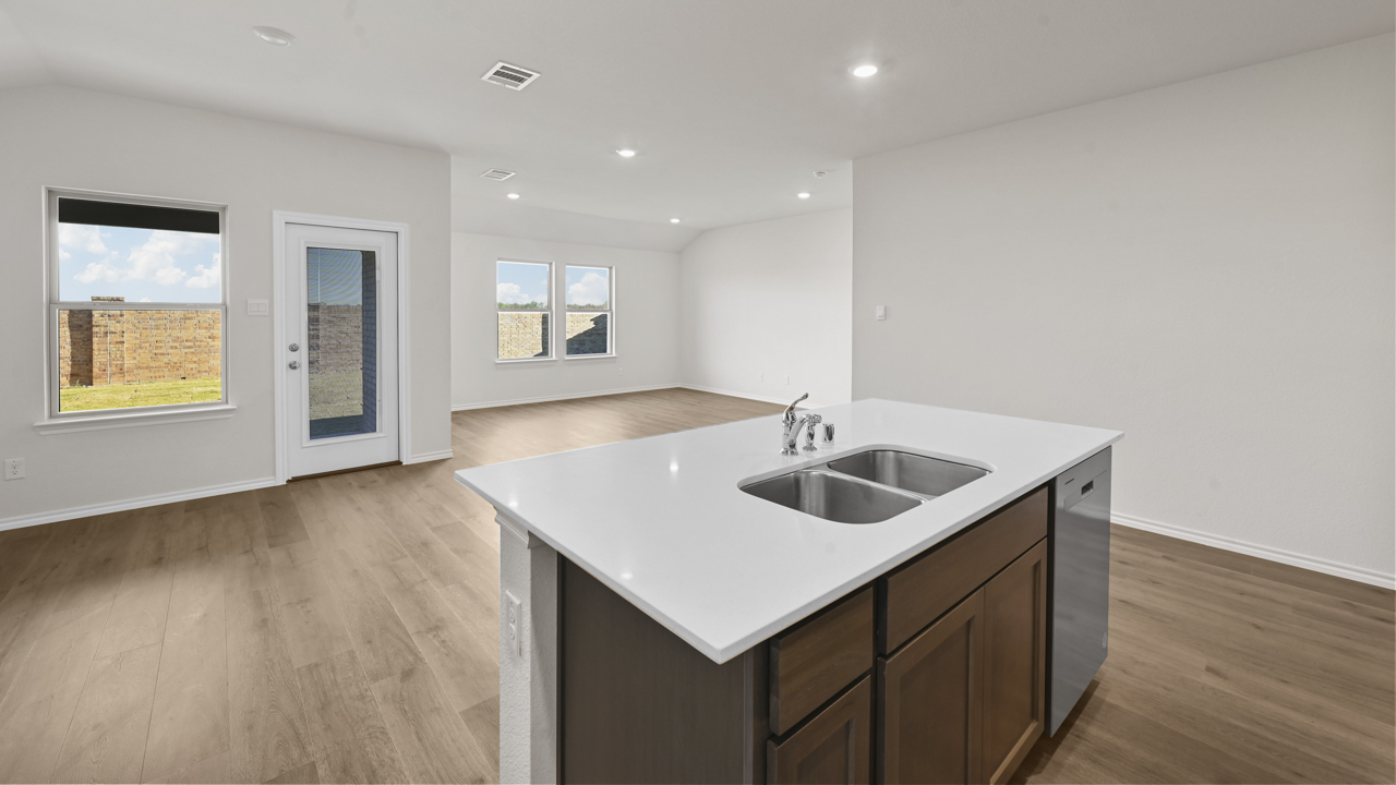 kitchen island with white countertop overlooking living room