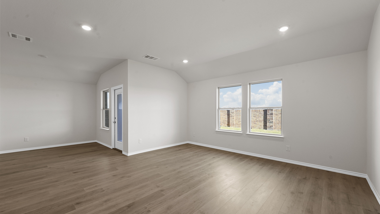 living room with windows and back door