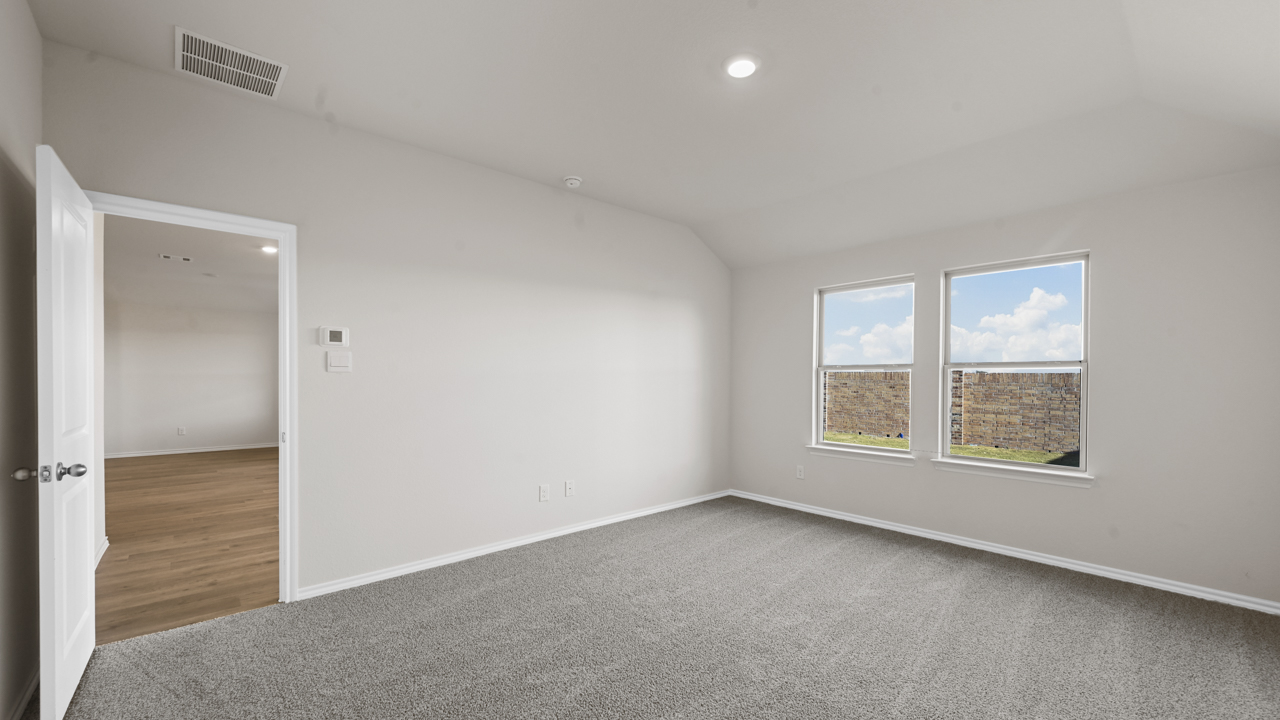 primary bedroom with double windows