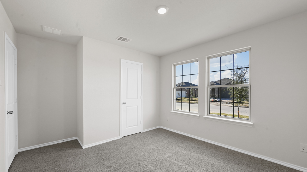 large bedroom with double window
