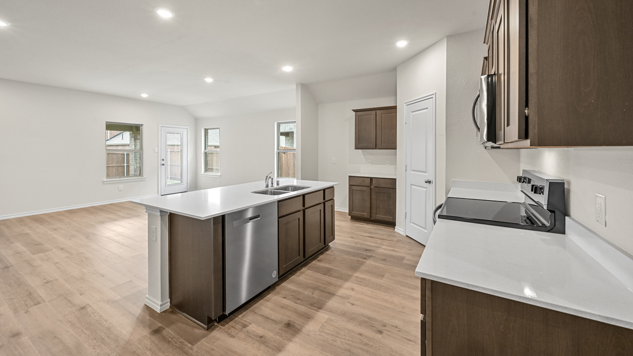 kitchen with island overlooking living room
