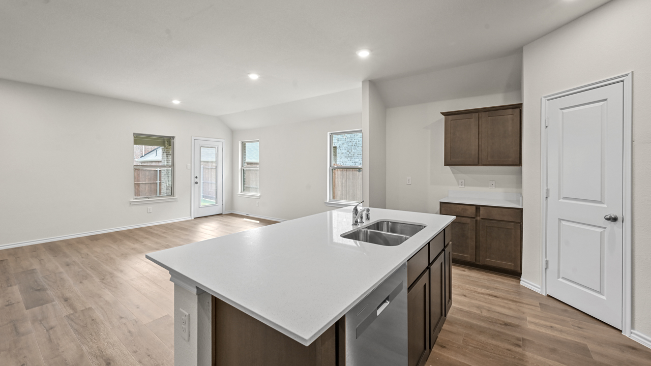 kitchen with island overlooking living room