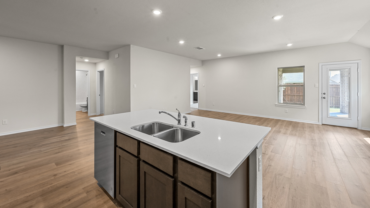 large white counter island overlooking living room