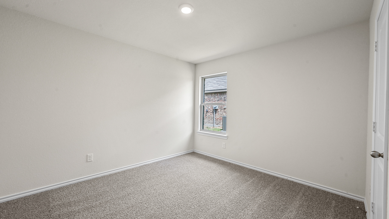 secondary bedroom with window