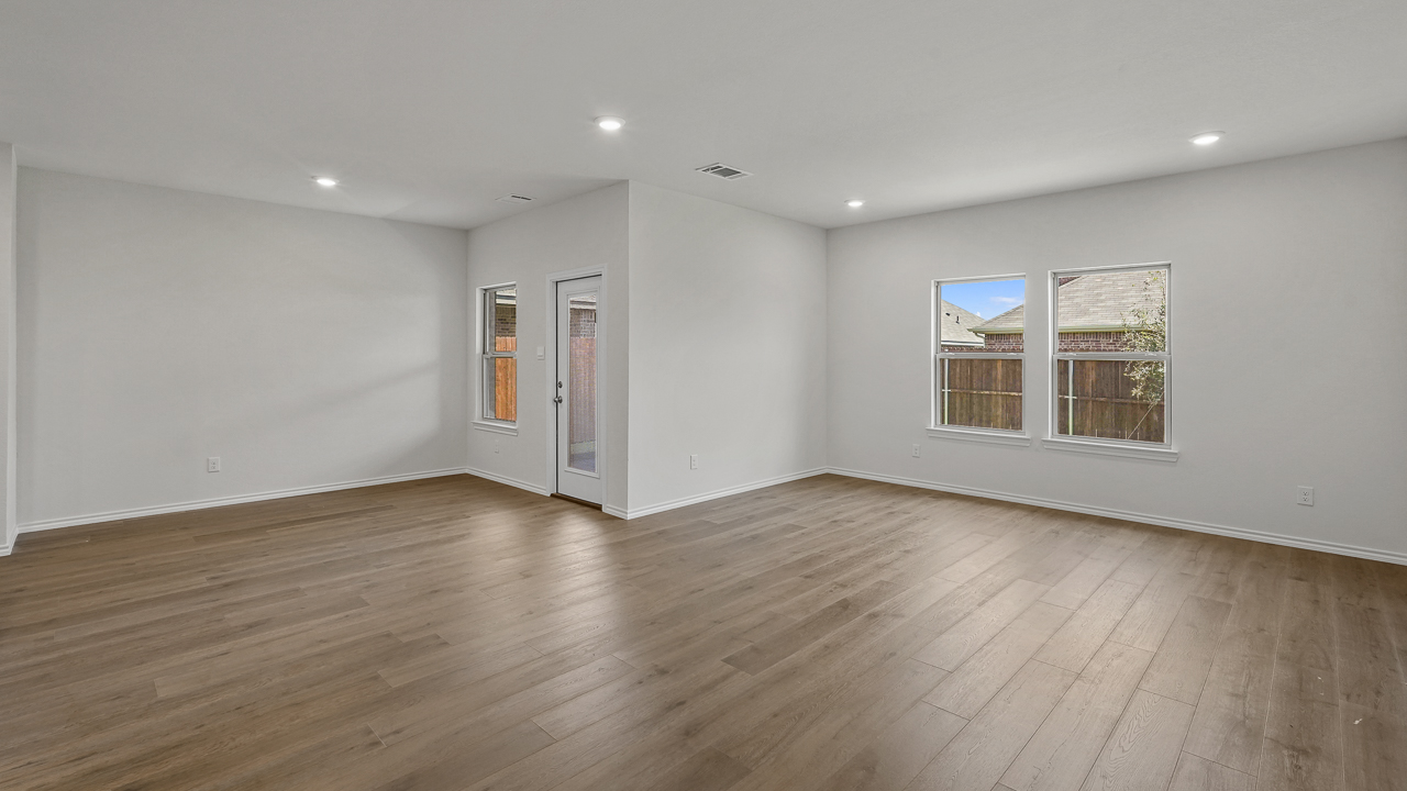 large living room with windows next to breakfast nook