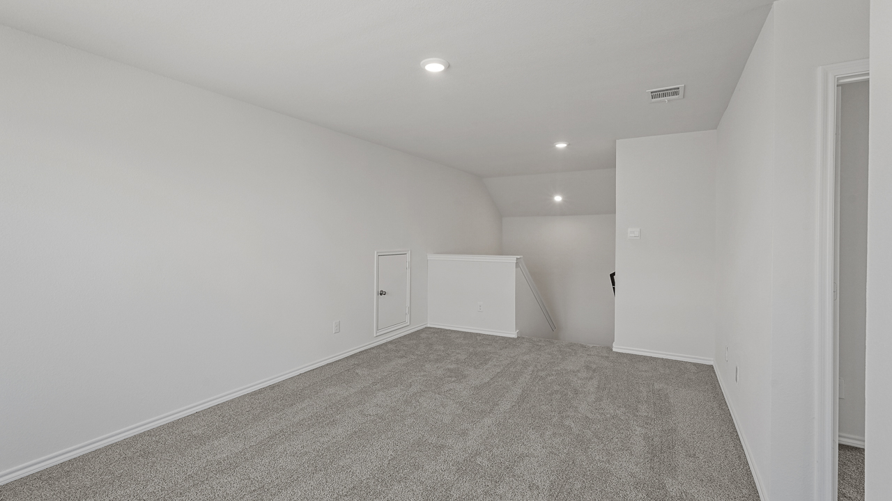 large media room overlooking upstairs hallway and staircase