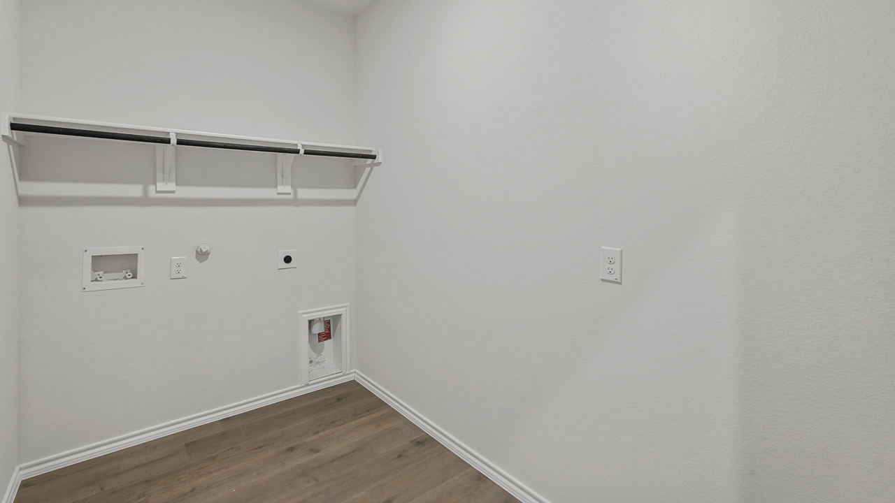 utility room with shelf and hanging rod