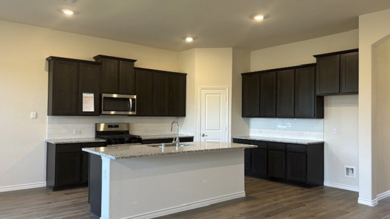 kitchen area with hardwood floors