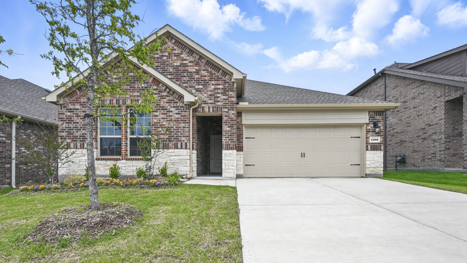 exterior of one story home with brick and stone