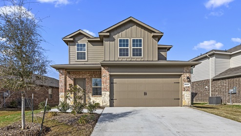 Two story home with brick stone and siding and covered front porch