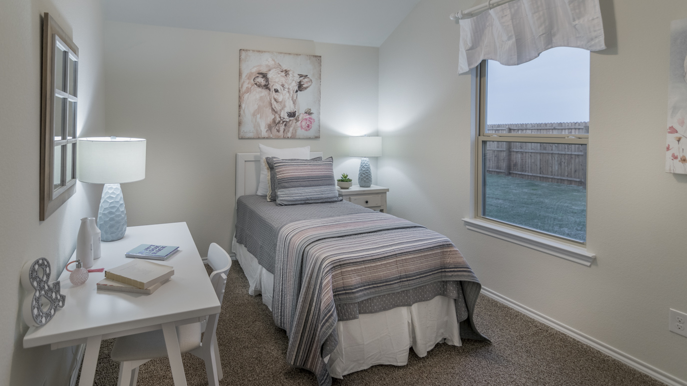bedroom 3 with light brown carpet and natural lighting