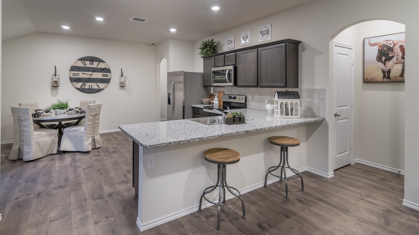 Kitchen overview showing extending countertop with granite