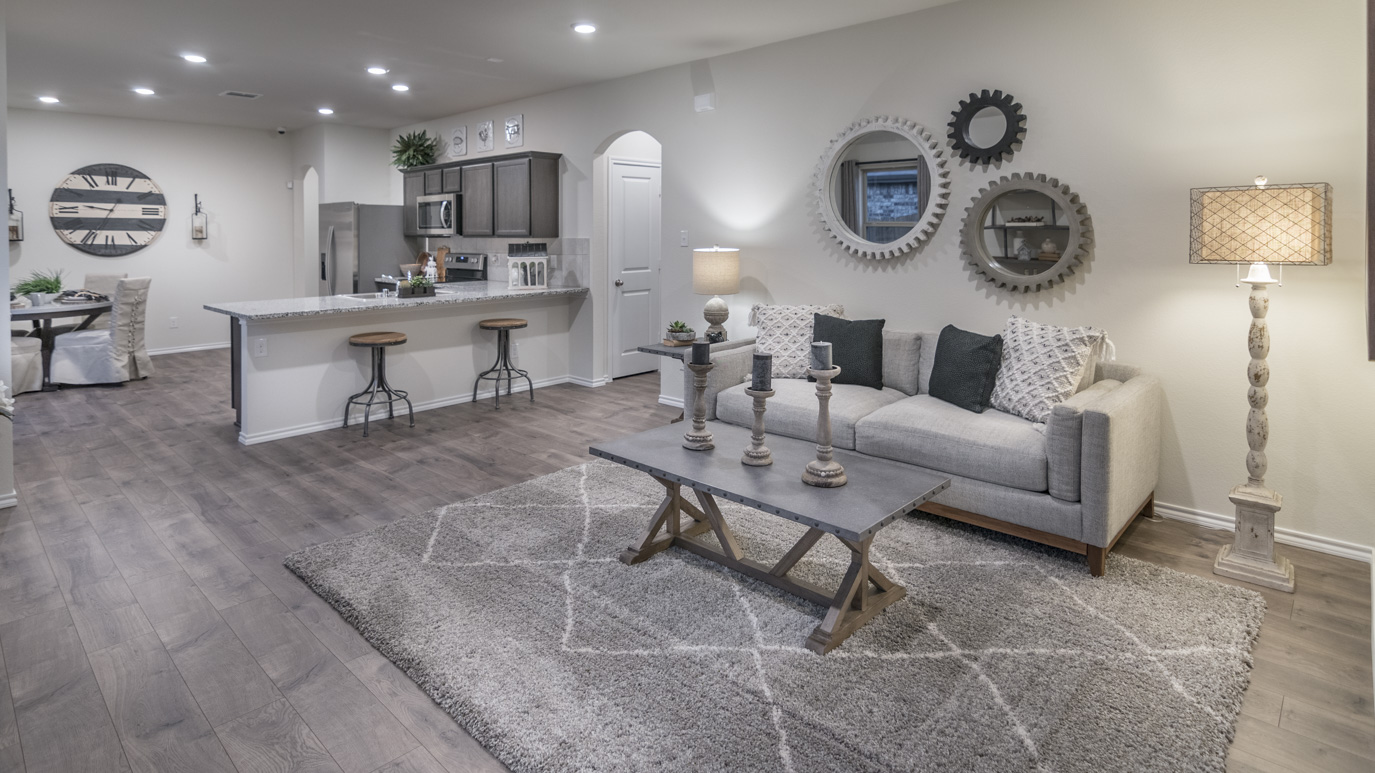 Overview of living room with brown hardwood floors