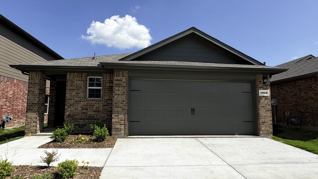 exterior of one story home with brick