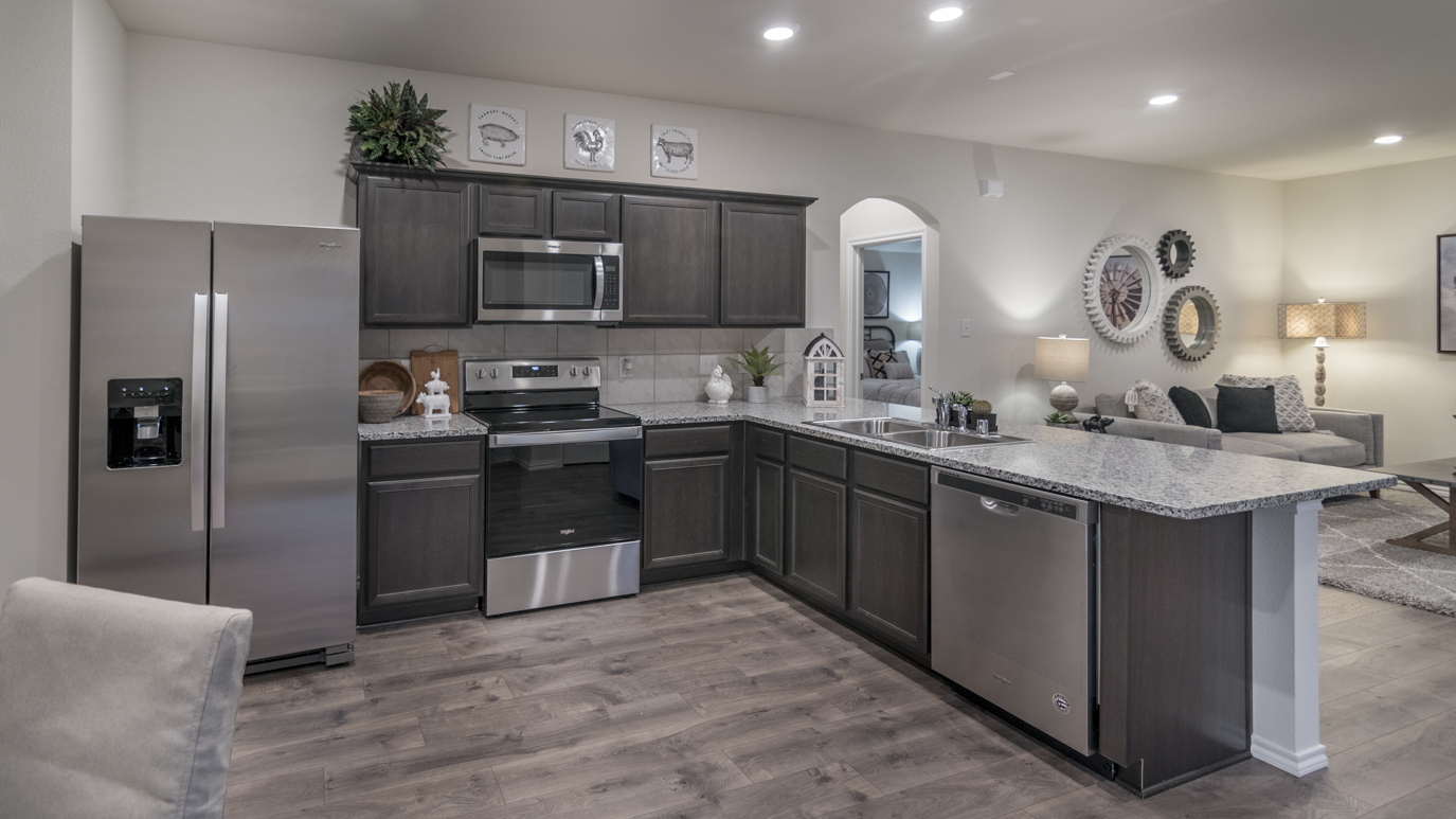 1519 kitchen area with white countertops and dark cabinets