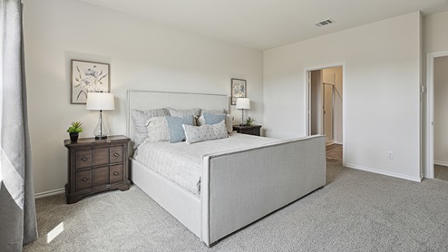 2015 Wildcat Trail model home at Wildcat Ranch in Crandall, TX primary bedroom with large windows