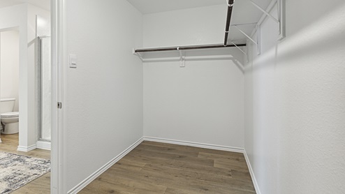 Model home - 2017 Wildcat Trail at Wildcat Ranch in Crandall, TX primary bedroom closet