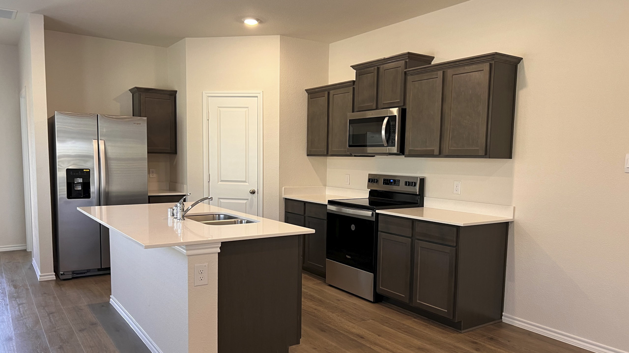 kitchen area with hardwood floors