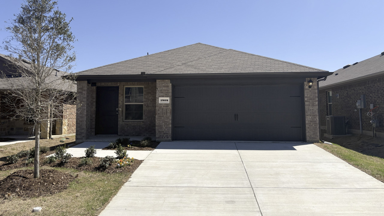 exterior of one story home with brick