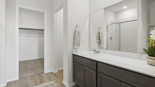 X30H primary bathroom with white cabinets and dark cabinets