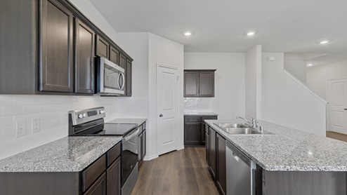 X30E kitchen area with granite countertops