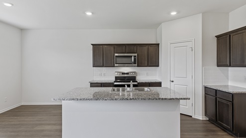 X30E kitchen with granite countertops and dark cabinets