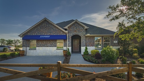 One story Trailstone model home with blue D.R. Horton awning and beautiful landscaping