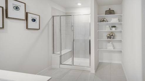 Large primary bathroom with storage shelves and standup shower